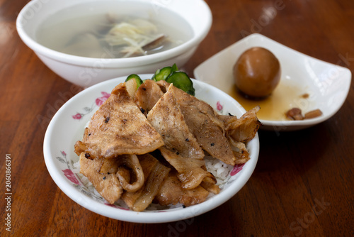 Taiwanese grilled pork rice bowl served with soup and braised egg