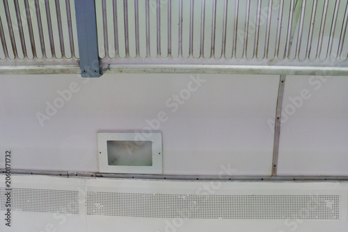 White ceiling panels with ventilation and lighting fixtures