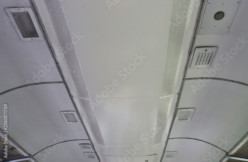 Clean ceiling panels in a modern bus interior