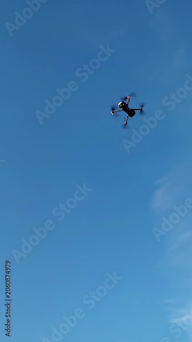 Clear 9:16 vertical frame sky, cerulean to azure gradient, wispy clouds. Smooth upward tilt video, soft daylight, deep focus. Concept of infinite possibilities