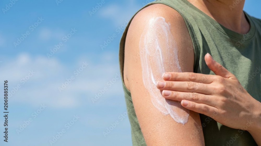 Obraz premium Sunscreen lotion uv protection safety skincare arm summer outdoor beach. uv safety ray. skincare skin shield, health dermatology prevention, care protection sunblock, ultraviolet sun summer
