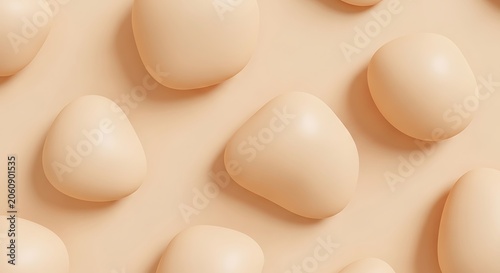 Minimalist pattern of smooth beige egg shapes on soft pastel background.