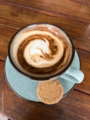 cup of cappuccino and cookie
