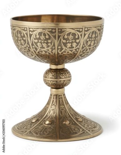 Ornate antique golden chalice with intricate engraved floral pattern details