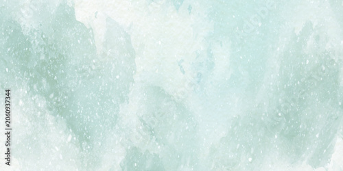 Soft mint green watercolor background with white specks and subtle texture for design and artistic projects