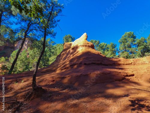 Fotografie Landscape of provencal colorado whose ocher color contrasts with the blue sky of