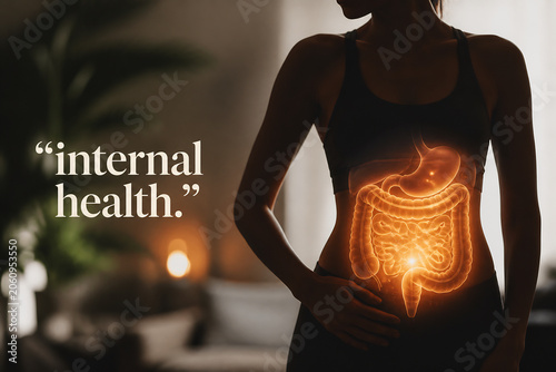 A silhouette of a person with an illuminated digestive system overlay in a dimly lit indoor setting.