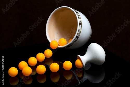 Still life with vases and orange balls