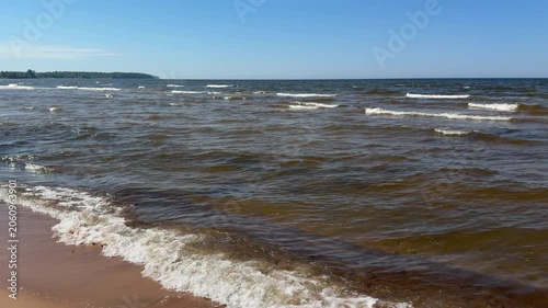 Baltic Sea waves near sandy beach in Jurmala Latvia