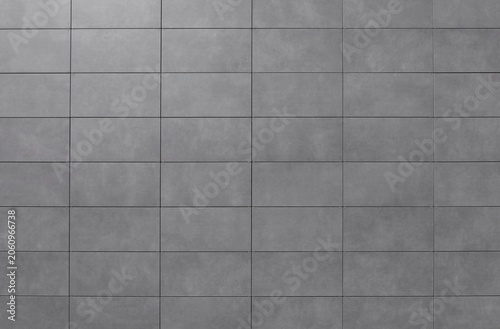 Fotografie Porcelain stoneware large gray tiles with stone effect on a ventilated facade