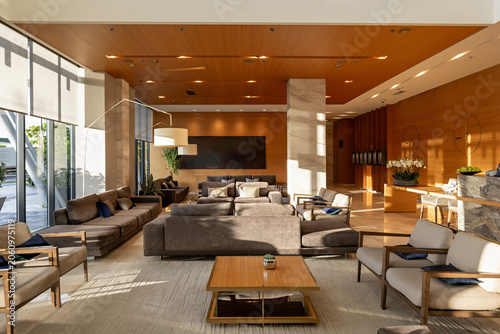 Tableau sur toile Luxury hotel lobby lounge area with comfortable sofas and warm lighting