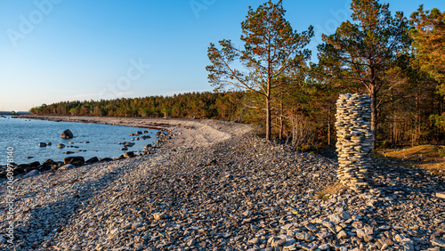 Konstfotografi beautiful rocky seashore, colorful water and bright sky, white, smooth stones,