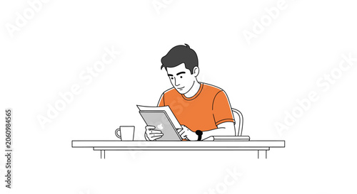 Young man sitting at a desk reading a book with a cup of coffee and a tablet