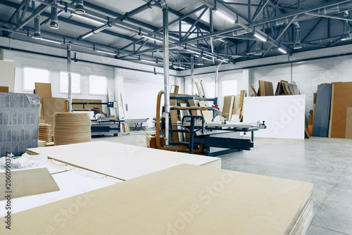 Φωτογραφία Furniture workshop space with tools and materials at work