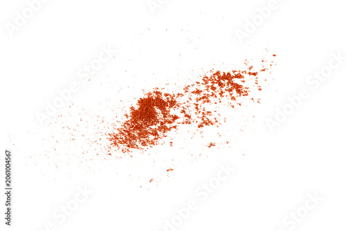 Quadro su tela Scattered fine red paprika powder splash with flying dust particles isolated on