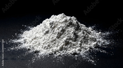 Kilos of cocaine powder on a dark surface