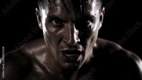 Close-up of a male boxer, close-up of an angry muscleman shouting
