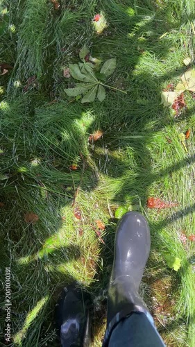 An explorer slops on the swampy, flooded area. Sound on: squash, squish and swish. One in waterproof boots carefully steps on the deluged soil