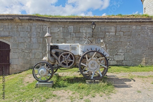 Historic Lanz Bulldog hot-bulb tractor displayed permanently inside the courtyard of Kuressaare Castle on Saaremaa, Estonia, Europe.