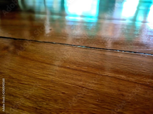 Cuadro en lienzo Low angle view of polished brown wooden parquet floor with reflection