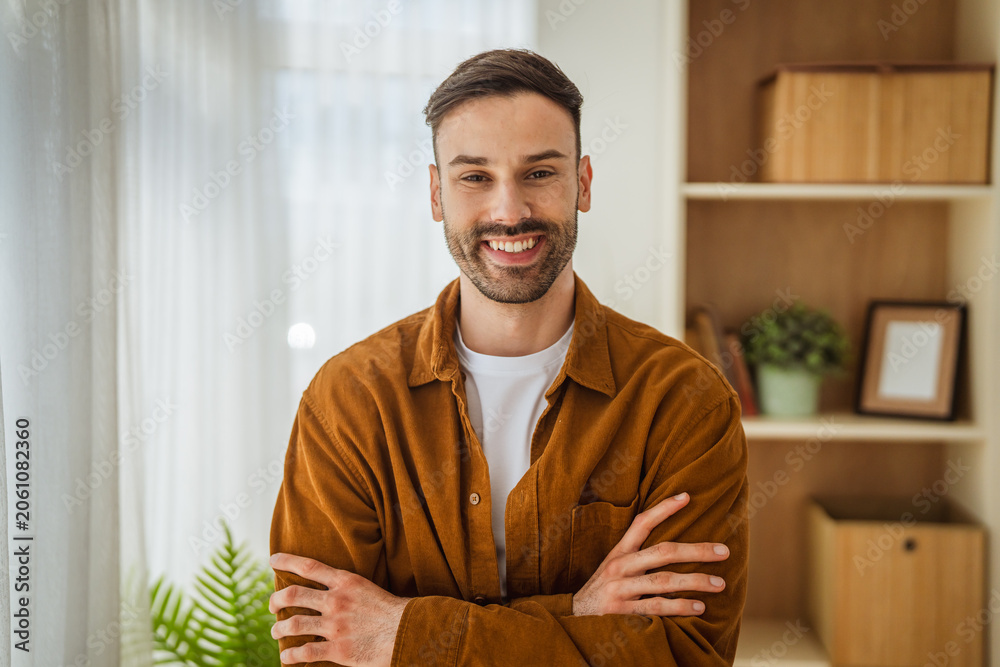 Fototapeta premium Young man smiling looking away feeling happy