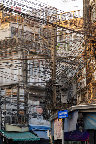 Chaotic Overhead Electrical Wiring in Bangkok Street