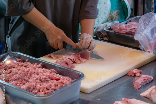 Butcher Preparing Fresh Pork Meat