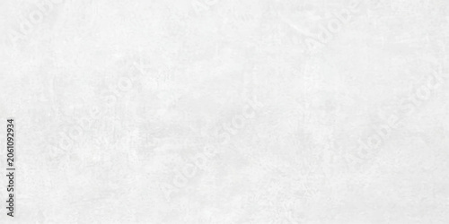 Fotografie A close-up of a textured, pale grey concrete surface, showcasing its subtle imperfections and weathered appearance