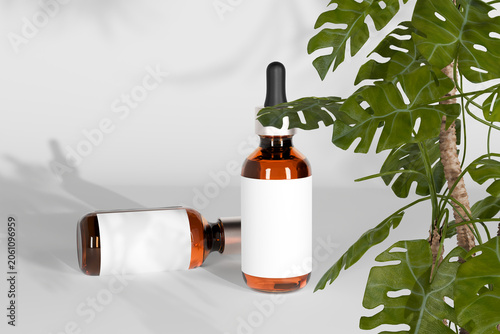 Cosmetic serum dropper bottles mockup with blank white label near monstera plant, amber glass essential oil templates for skincare branding, standing and lying position, realistic 3d render