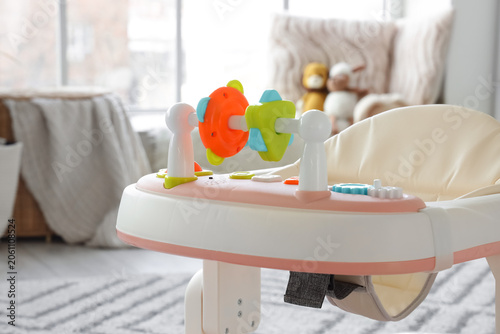 Baby walker in living room,...