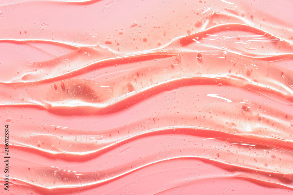 Obraz premium Texture of snail mucin gel on pink background