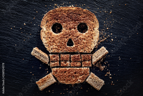 Obraz na płótnie Toast with skull and crossbones concept for allergen care and gluten intolerance
