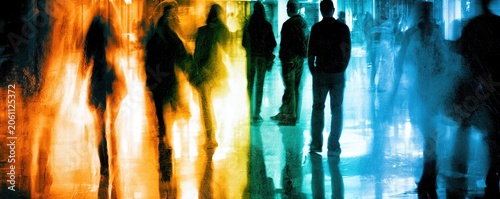 Blurry figures with vibrant orange and blue light streaks reflect on floor