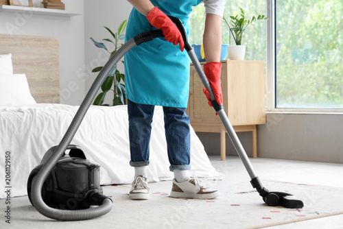 Male janitor with modern va...