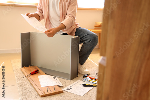 Man with instructions assem...