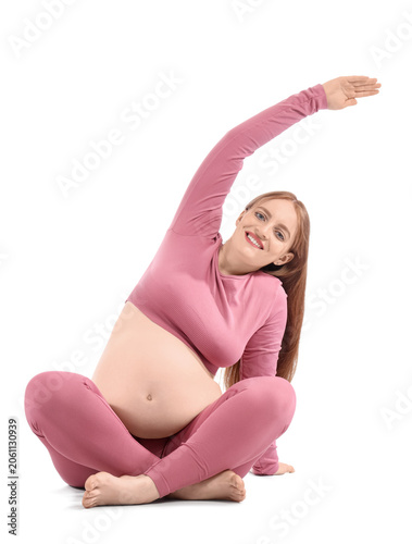 Sporty pregnant woman stret...