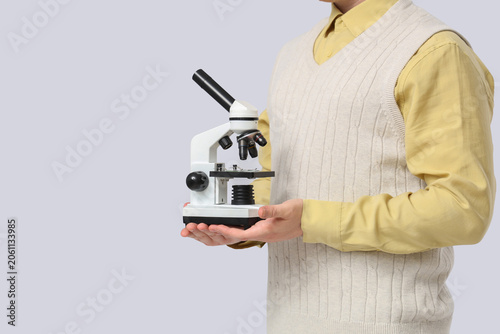 Young male teacher with mic...