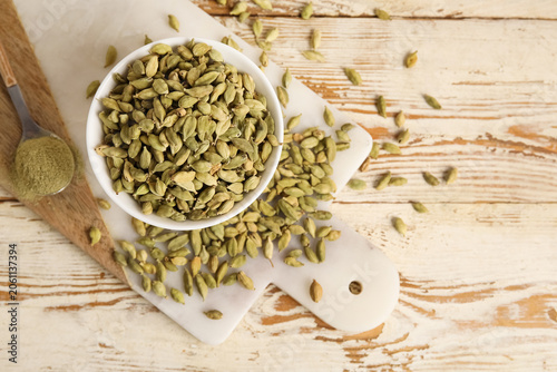 Bowl of cardamom spice and ...