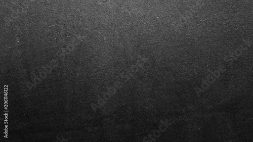 black woven fabric texture glides past cinematic macro lens revealing moody dark industrial minimalism
