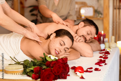 Young couple getting massag...