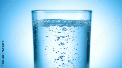 Liquid material with rising bubbles in a glass, clear glass
