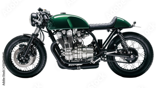 Green cafe racer motorcycle with chrome engine and black seat