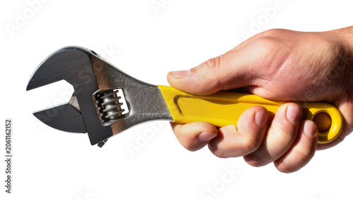 Foto Hand holding adjustable wrench with yellow handle