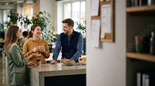 Generative AI, Three Business Colleagues Laughing Together During Coffee Break in Modern Office Kitchen