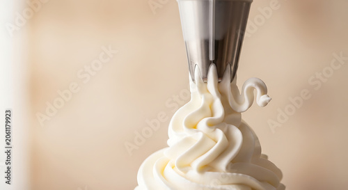 Whipped cream from a piping bag.
