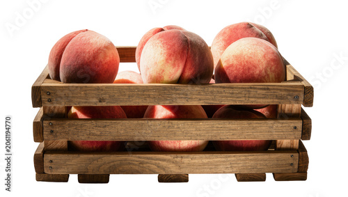 Photos Ripe fuzzy peaches overflowing from a rustic wooden crate, isolated on transpare