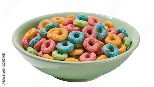 Foto Colorful fruit flavored cereal loops in a light green bowl