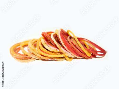 Cuadro en lienzo Colorful elastic rubber bands pile isolated on white background