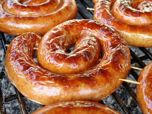 Baked homemade Chevalatta sausage  lie on a grill, grilled foods,   background.