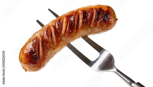 Obraz na plátně Grilled sausage on metal fork with grill marks